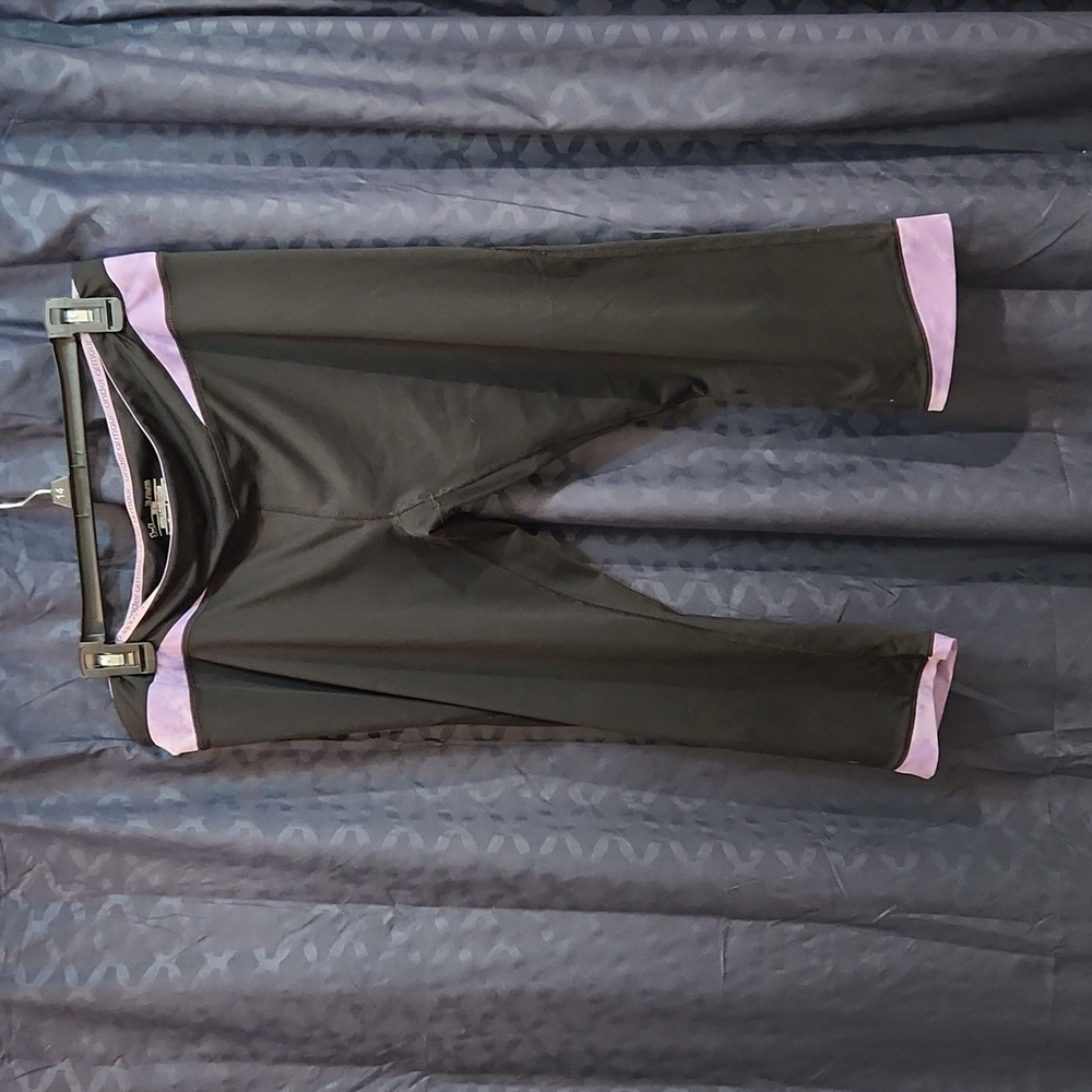 Under Armour xl work out pants. Black and Purple.  Great condition